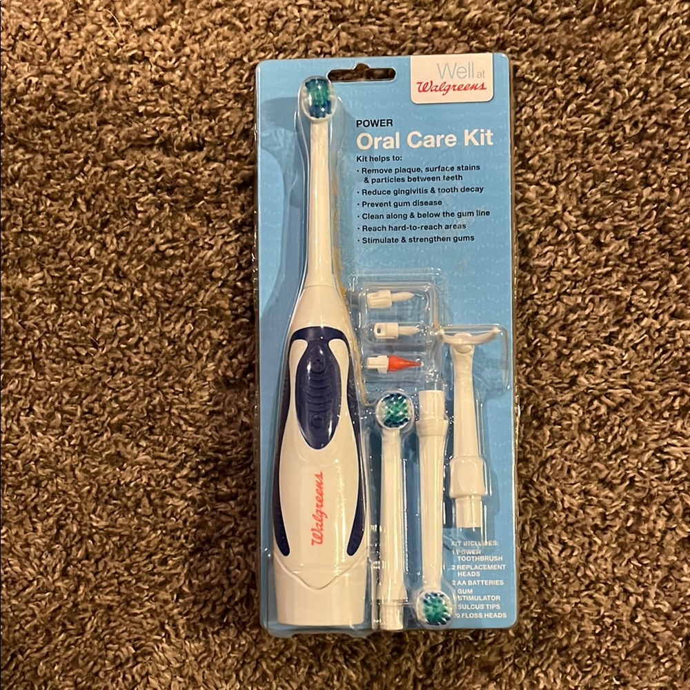 White and Blue Electric Toothbrush Set with Multiple Attachments